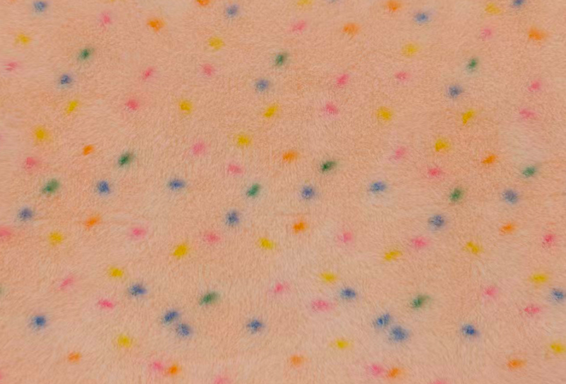 Minktryck i ren polyester med färgglada prickar Minktryck i ren polyester med färgglada prickar